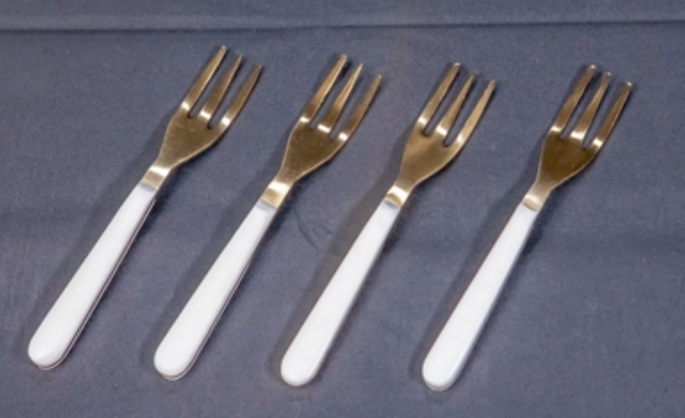 SET OF FOUR COCKTAIL FORKS WITH WHITE RESIN HANDLES